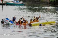 Kingsbridge - Kingsbridge Fair Week - Raft Race - The "Faux Fur Vikings" celebrate sinking "Toad Hall"